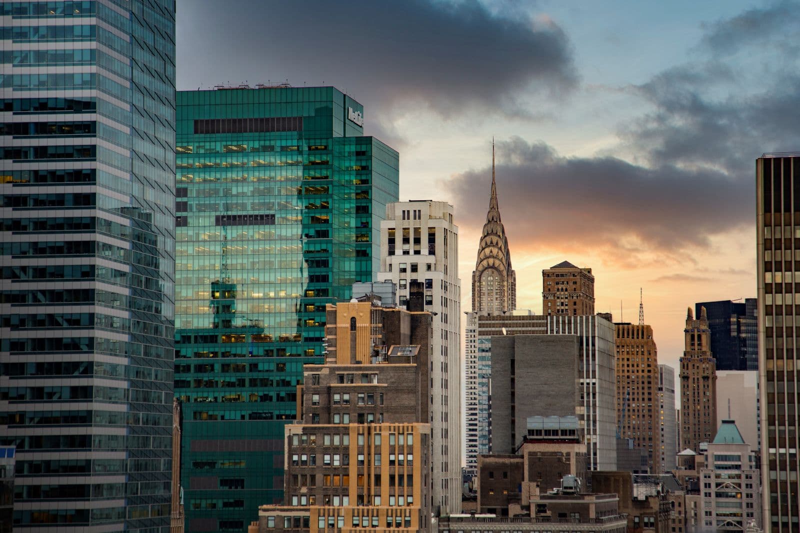 U.S. city skyline at sunset — investment property financing through the AM Premier+ Loan Program